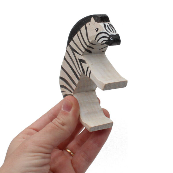 Zebra Head Down Wooden Figure in hand by Good Shepherd Toys